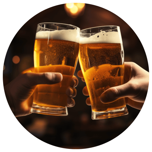 Two glasses of beer being brought together for a toast in golden light.